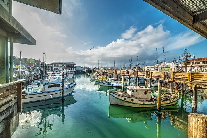 Boats docked at a picturesque harbor on a sunny day